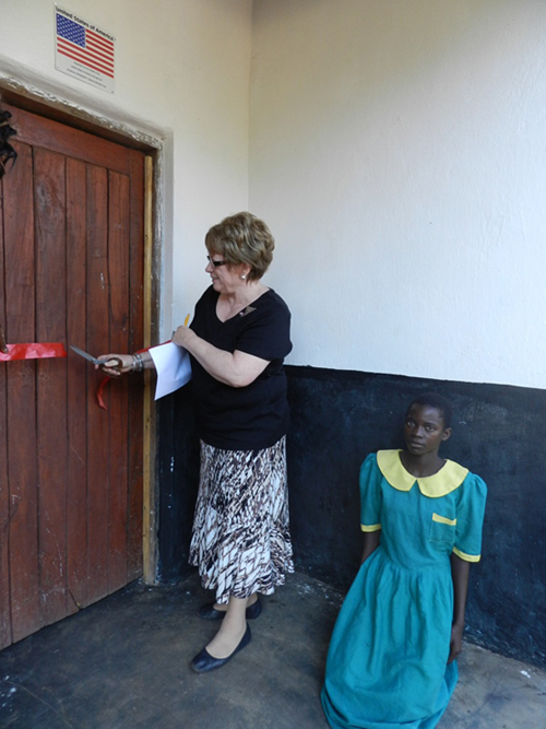 Mrs Diana Enzi, the wife of the late US Senator Michael Enzi, officially cuts the ribbon to open the library and the teachers’ office block at Chimvite Primary School in Lilongwe Rural South West.